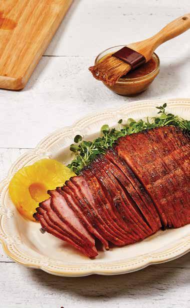 GLAZUROWANA SZYNKA GLAZUROWANA SZYNKA dla 6 osób 1,5 kg szynki, przekrojonej na połowę, bez kości ¼ szklanki soku z ananasa ½ szklanki brązowego cukru ½ szklanki musztardy ½ łyżeczki zmielonych