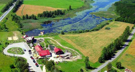 4. Zagroda turystyki wiejskiej Smuklė Žarija 4. Kaimo turizmo sodyba Smuklė Žarija Pośrodku logo gospody Žarija znajduje się feniks. Ptak odradzający się z popiołu.