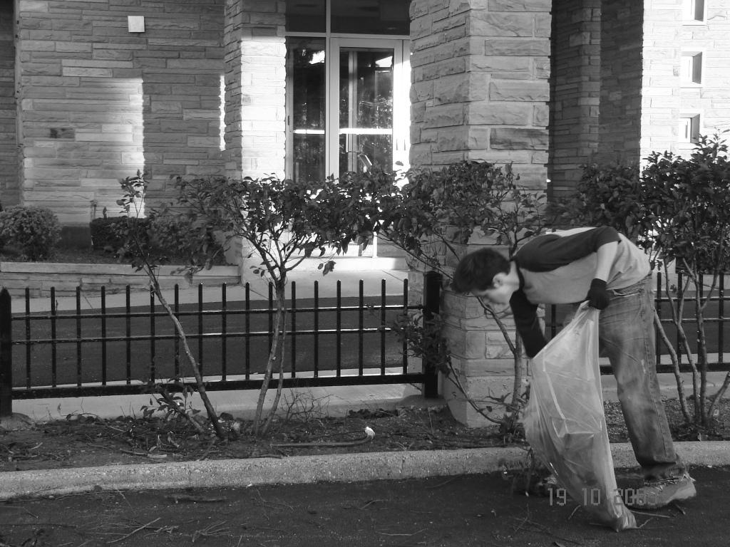 To the right, we see a volunteer who helped with the trimming of the bushes around the church.