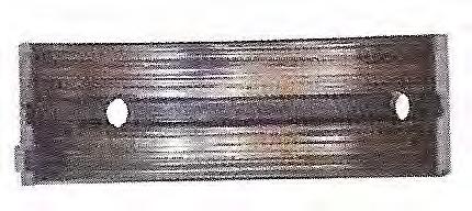 Zadanie 8. Ilustracja przedstawia Zadanie 9. A. półpanewkę bez wyraźnych uszkodzeń. B. wyrwanie fragmentu warstwy ślizgowej półpanewki. C.